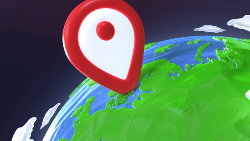 En stor röd platsmarkör ovanpå en tecknad jordglob med gröna landområden och blått hav.