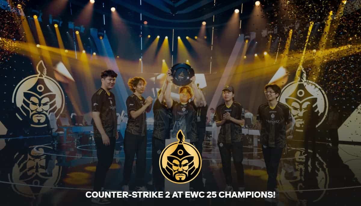 Spelare firar segern i Counter-Strike 2 på EWC 25-scenen med trofé och konfetti.