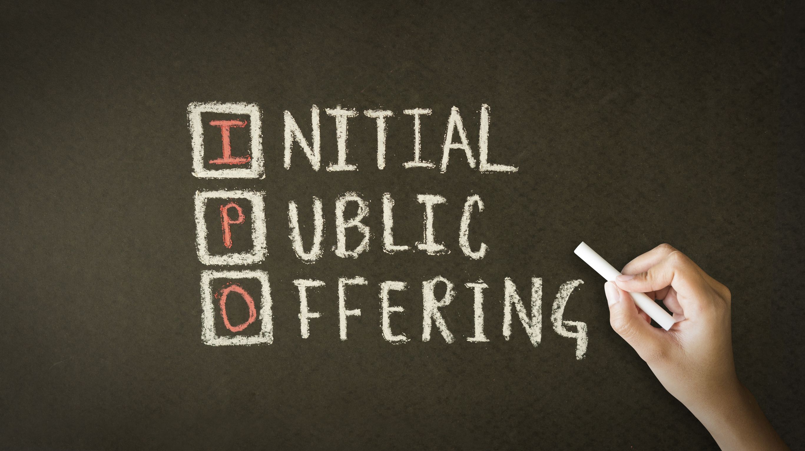 19941206 - a person drawing and pointing at a initial public offering chalk drawing