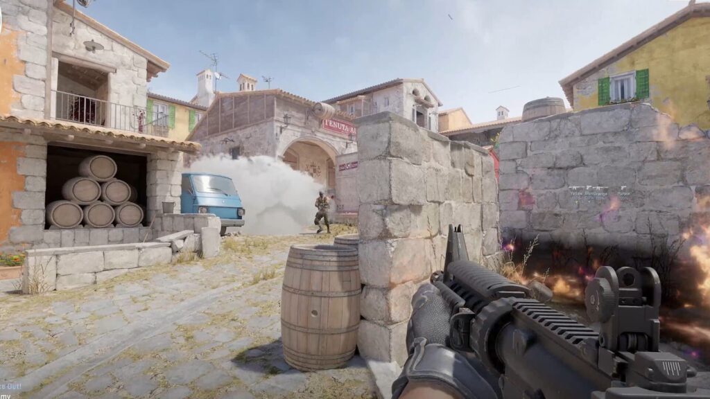 A soldier takes cover behind a stone wall in a smoke-filled urban scene while aiming a rifle, in a Counter-Strike 2 (CS2) game.