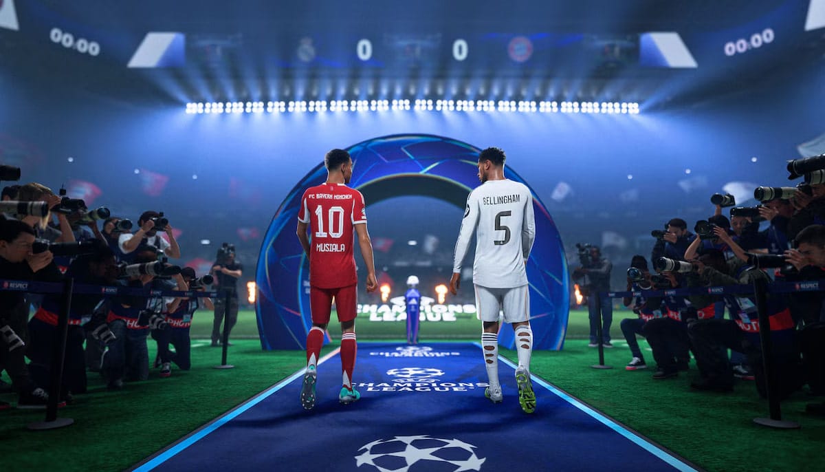 Two soccer players in red and white jerseys walk towards a stadium entrance, surrounded by photographers
