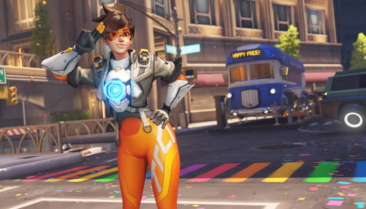 Tracer on a Pride-themed Overwatch 2 map during the 2025 event, showcasing new cosmetics, decorations, and rewards.