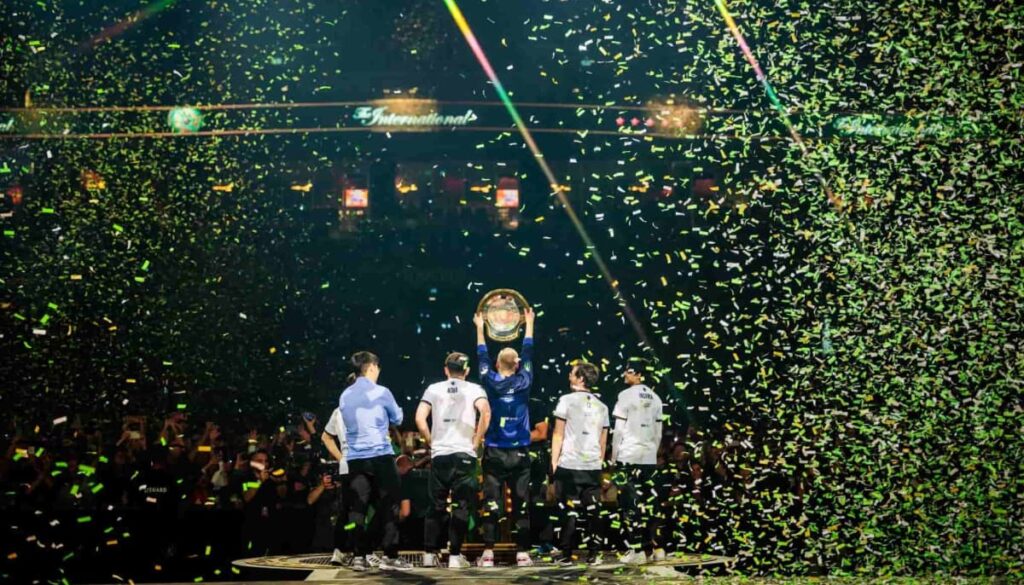 One of the top esports teams celebrating a major tournament victory on stage, symbolizing the success of leading organizations to watch in 2025.