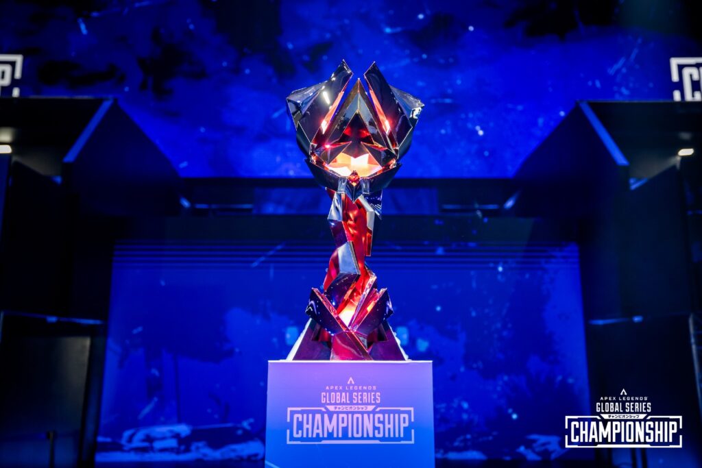 Image of ALGS Championship trophy on a platform with a stage in the background