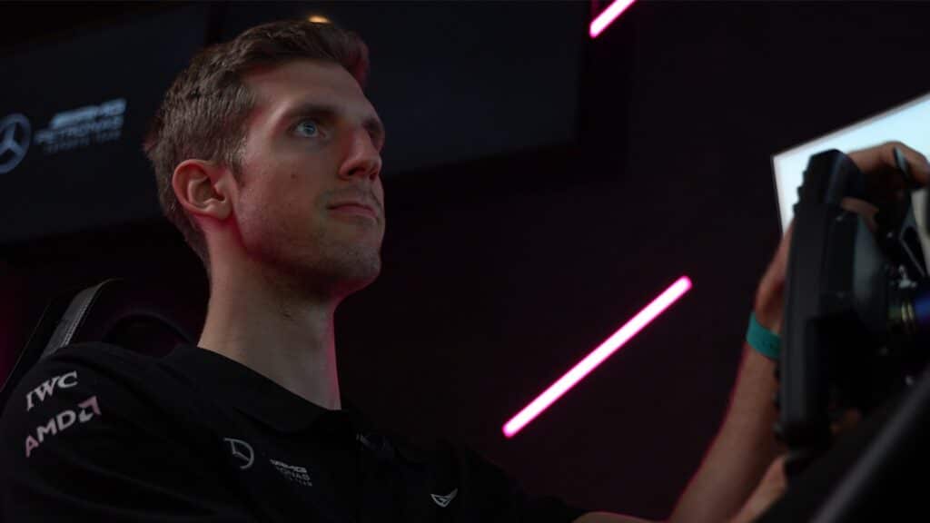 Image of Dani Bereznay looking at screen while sat at a sim racing rig.