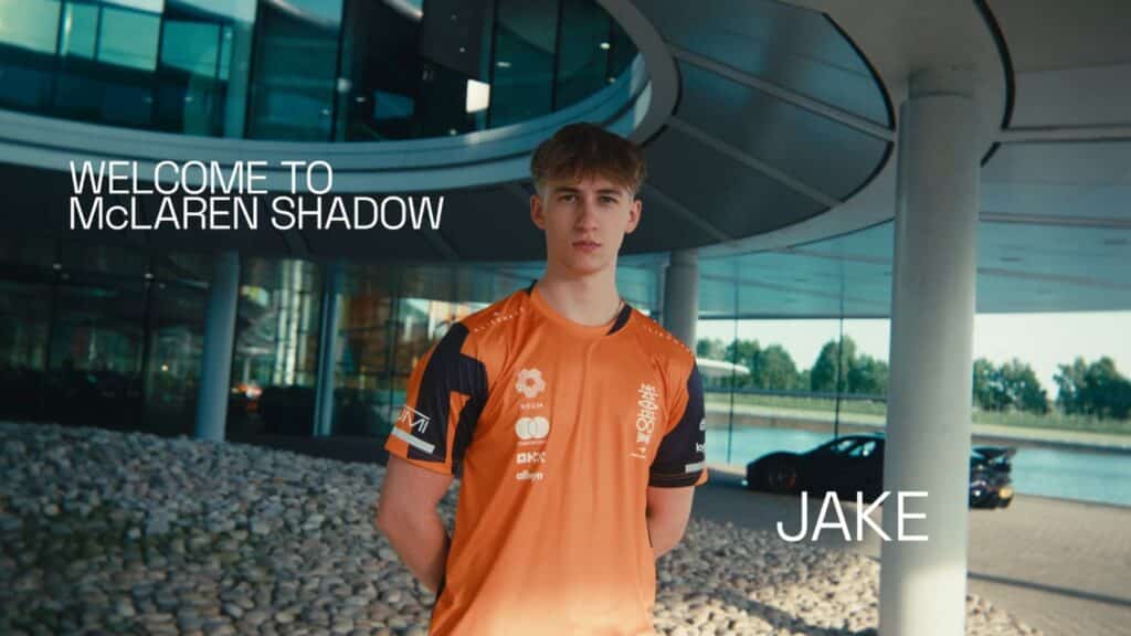 Image of Jake Benham standing with hands behind back while wearing McLaren Shadow jersey