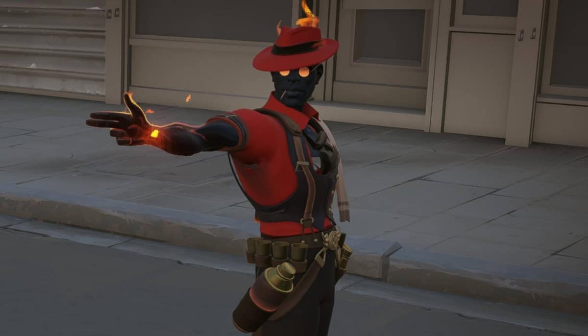 A character of Deadlock in a red hat and vest with glowing features stands on a sidewalk, arm outstretched