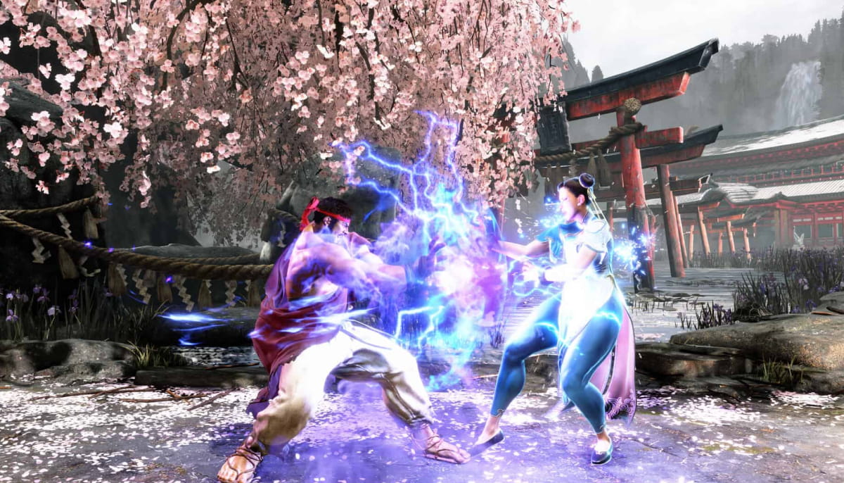 Two fighters engage in a dynamic battle surrounded by cherry blossoms and traditional architecture, with energy effects illuminating the scene in Street Fighter 6