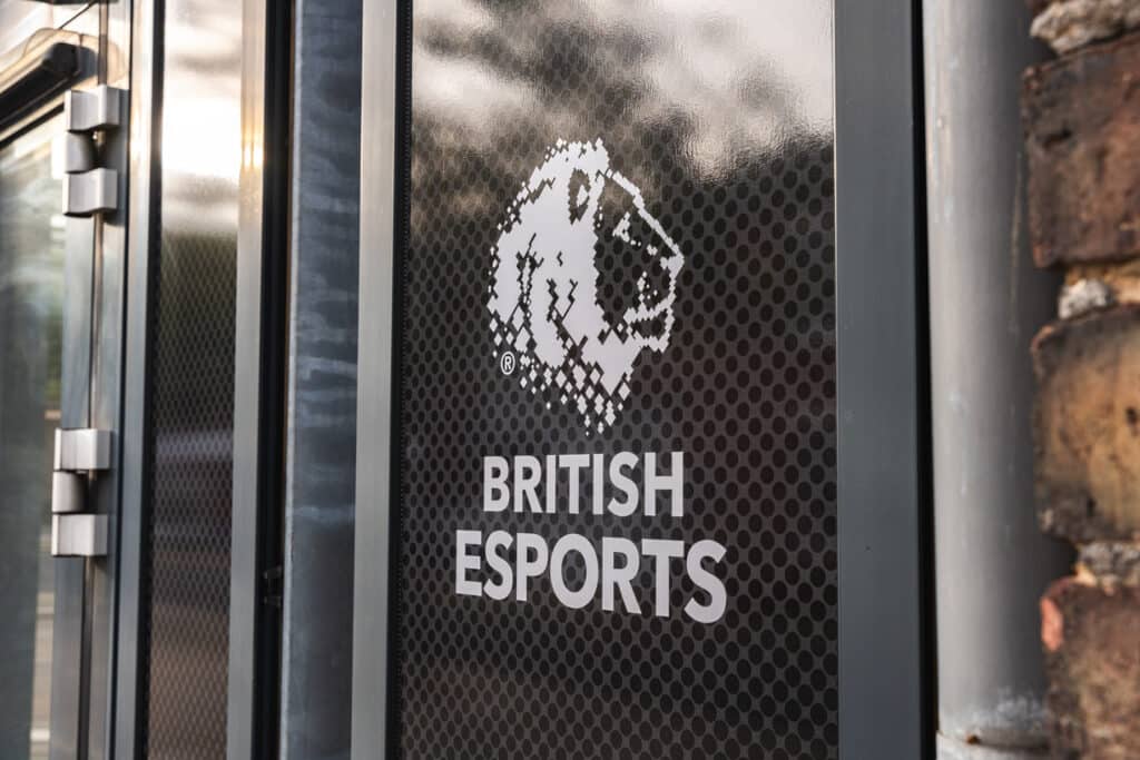 Image of British Esports logo on the glass panel of a door