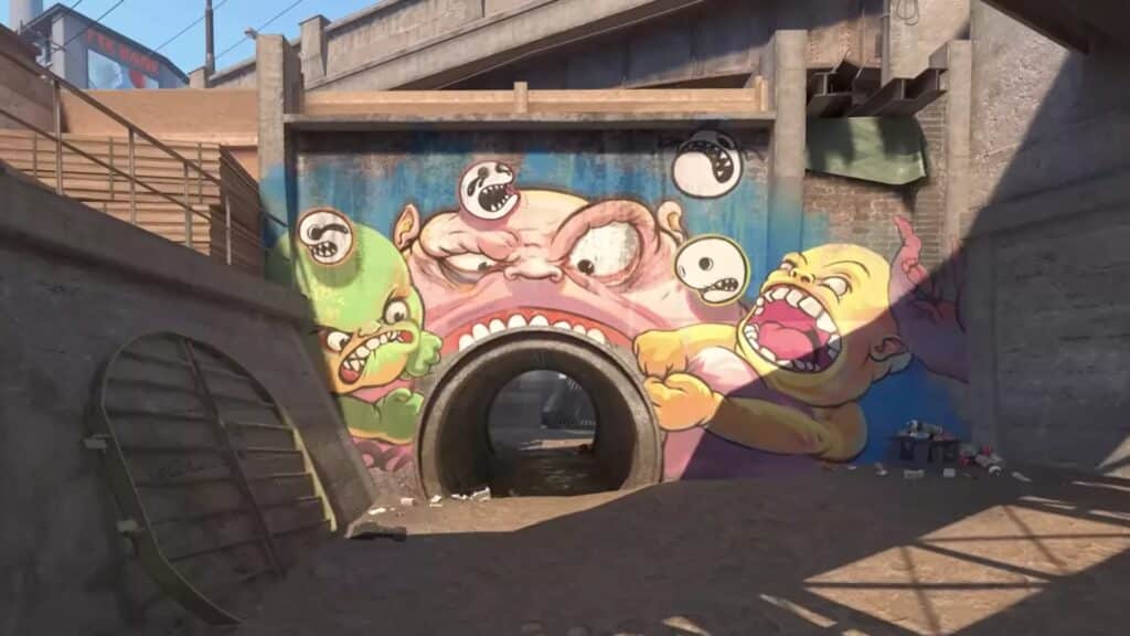 Image of CS2 map Overpass with graffiti of monsters surrounding an entrance to a tunnel
