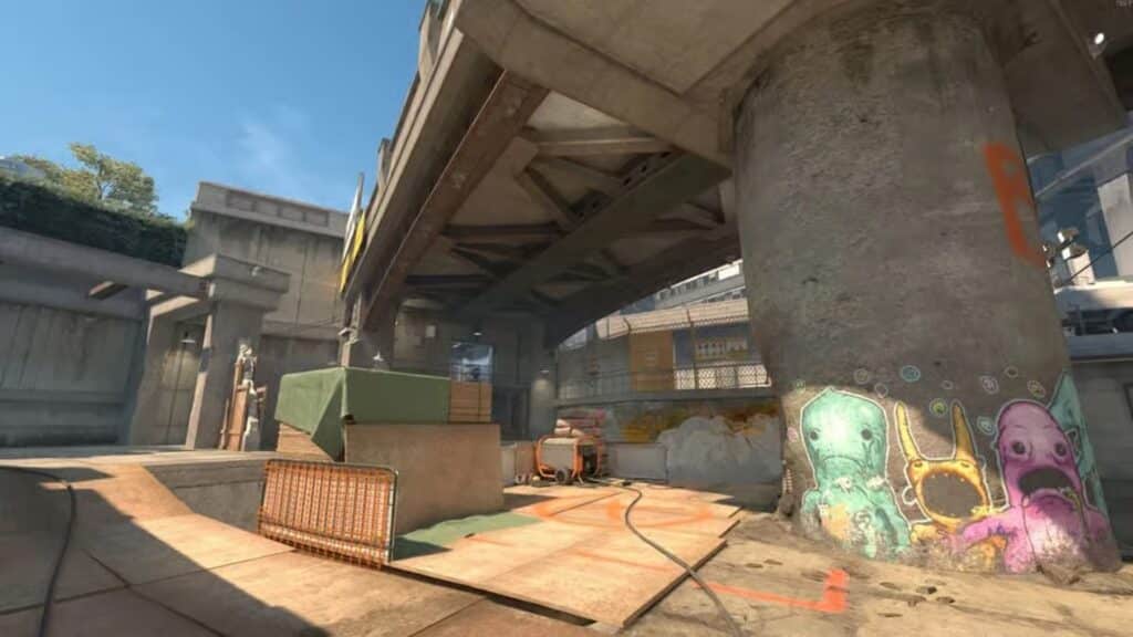 Image of Overpass Counter-Strike 2 map. A bridge covers a building site covered with wooden boards and fencing.