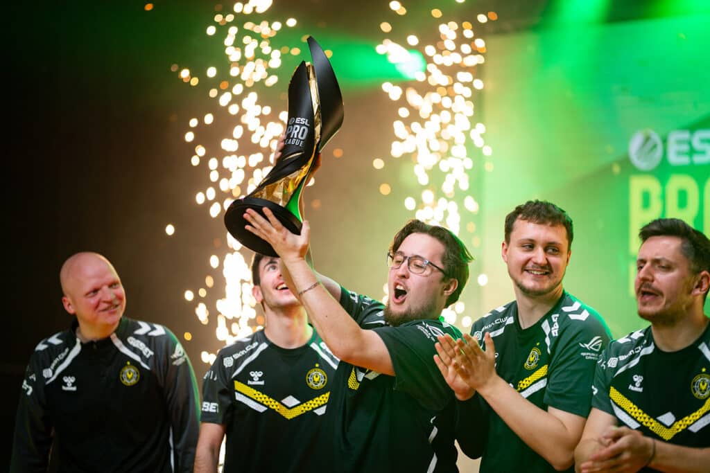 Image of Team Vitality Counter-Strike roster lifting ESL Pro League trophy. Sparks are firing into the air in the background