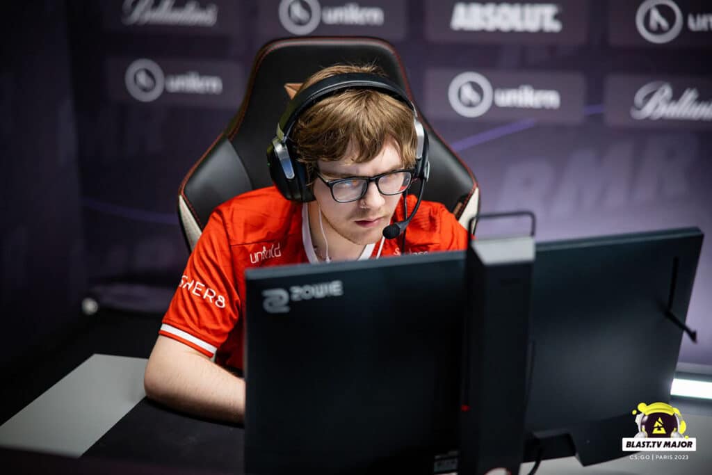 Image of Counter-Strike player Cypher competing at BLAST.tv Paris Major. The player is wearing a red Into the Breach jersey