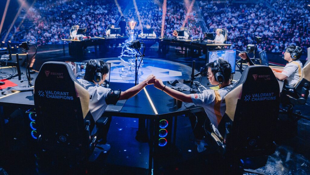image of two esports players touching hands