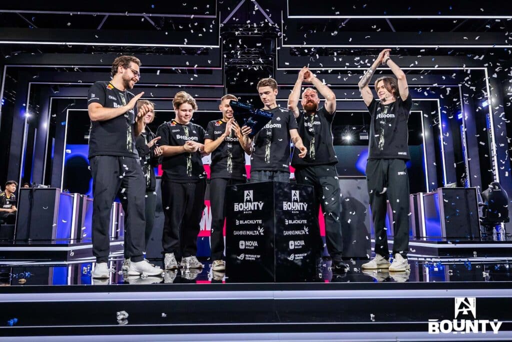 Image of Team Spirit Counter-Strike team celebrating victory at BLAST Bounty Season 2. One of the players is holding the trophy