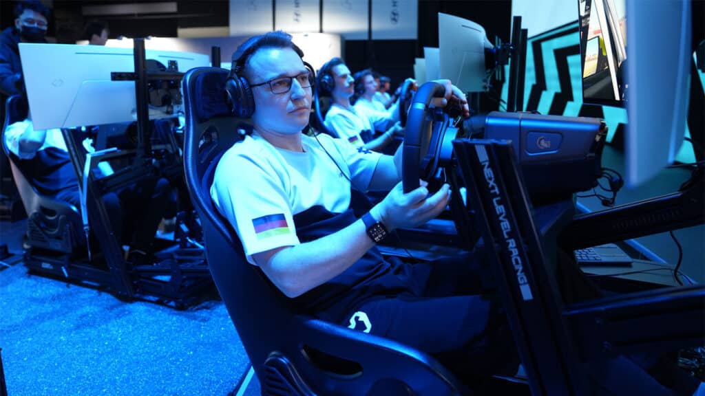 Image of sim racing driver using steering wheel on a Next Level Racing sim rig