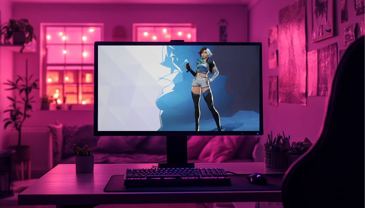 A gaming setup with a monitor displaying a female character in futuristic attire