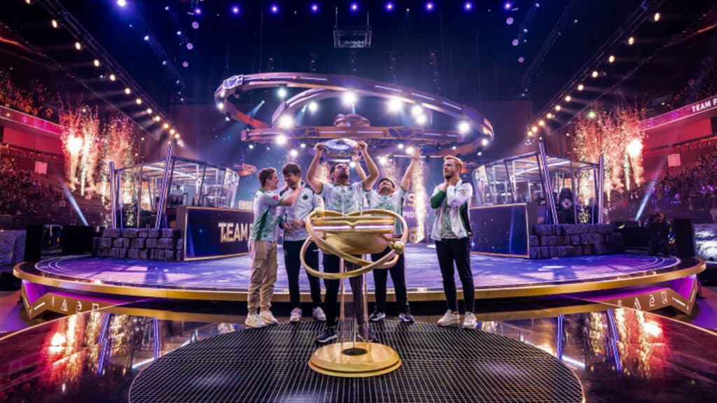 Image of Team Falcons lifting The International 2025 trophy on stage