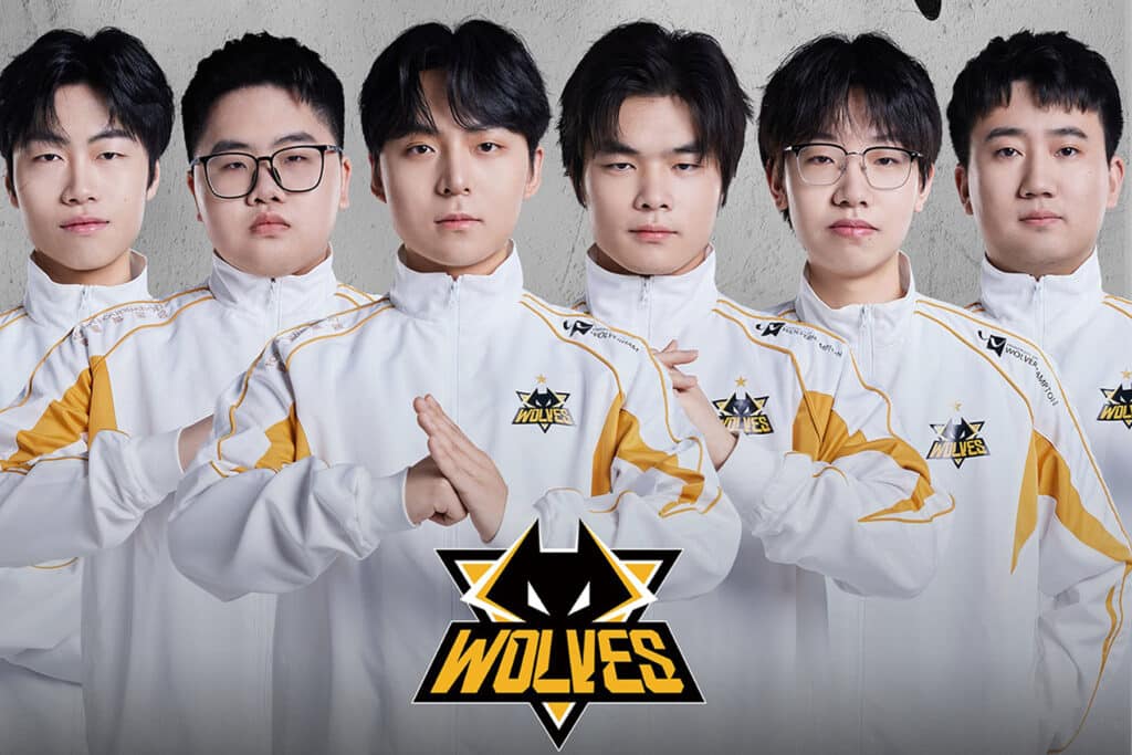 Image of Wolves Esports COD Mobile roster posing while wearing white Wolves Esports jackets. The Wolves Esports logo is in the foreground