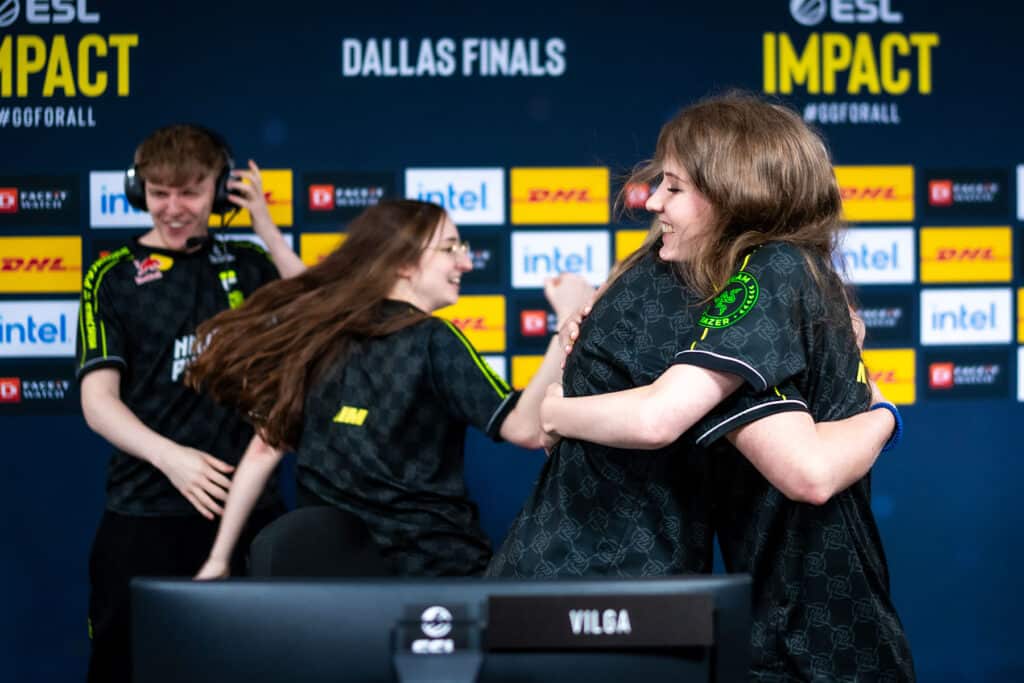 Image of NIP Impact Counter-Strike team hugging while competing at ESL Impact event