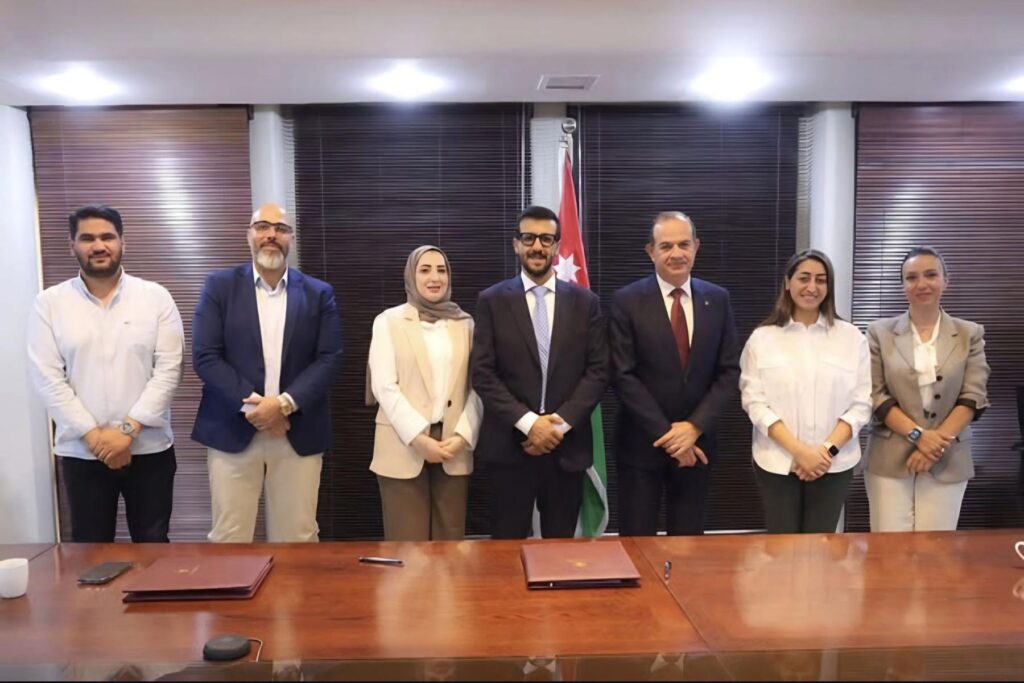Image of JEG Esports and Jordan Ministry of Digital Economy representatives standing together behind table