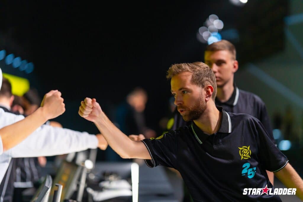Image of Ninjas in Pyjamas Counter-Strike coach fist bumping at StarLadder Budapest Major 2025