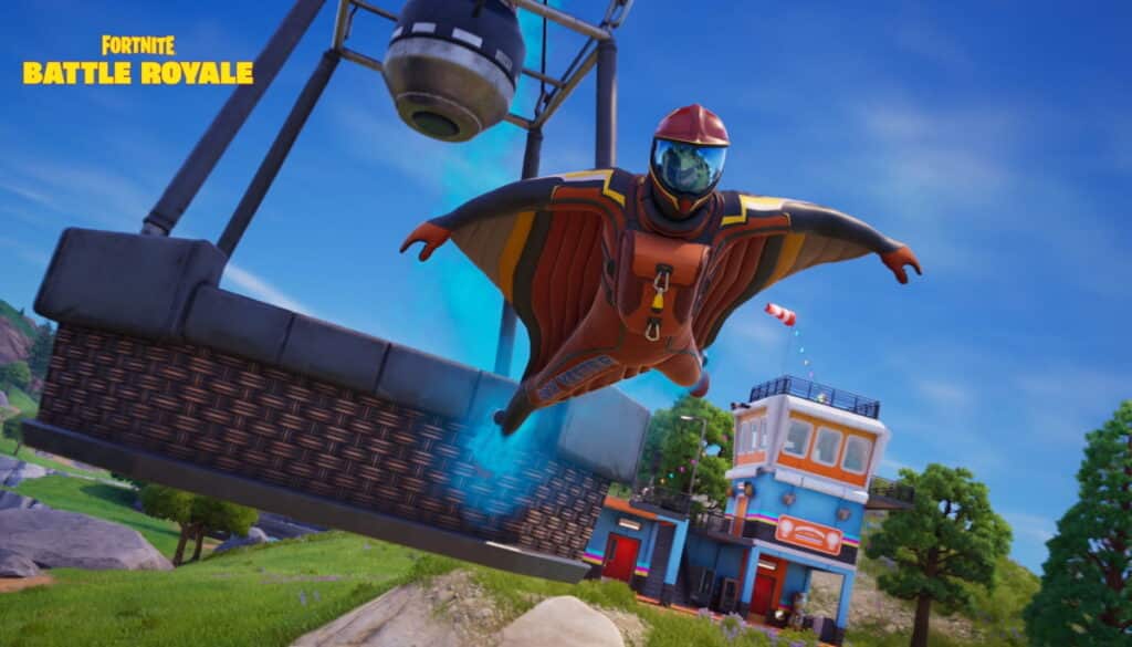 A character in a wingsuit flies past a hot-air balloon in Fortnite Battle Royale