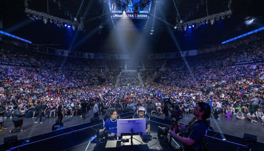 The image shows an esports competition the Evolution Championship Series (Evo), the world's largest fighting game event