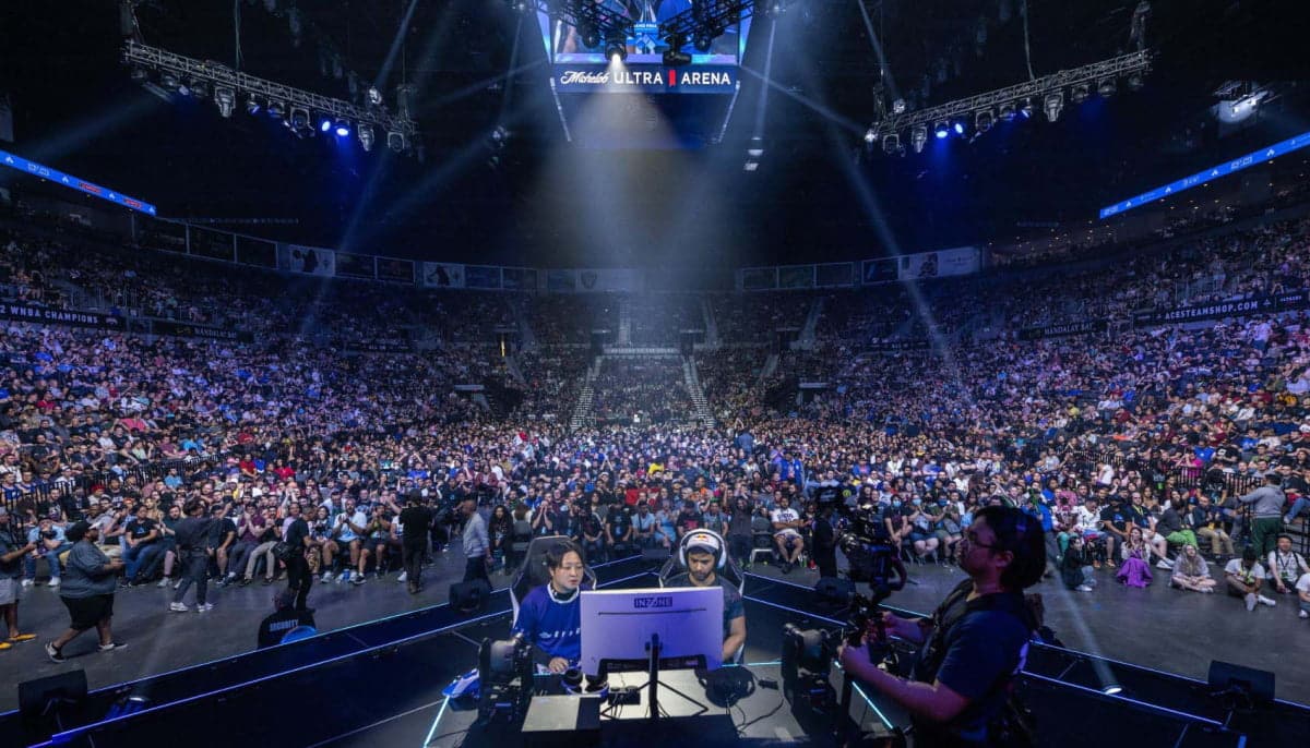The image shows an esports competition the Evolution Championship Series (Evo), the world's largest fighting game event