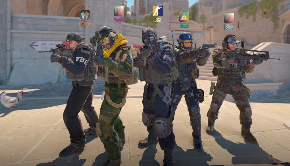 Five Counter-Strike 2 counter-terrorist characters stand side by side in a stone courtyard, aiming rifles and pistols. Each player has a colored label above their head (Orange, Purple, CS2, Green, Blue), and they wear different tactical uniforms, helmets, and gear
