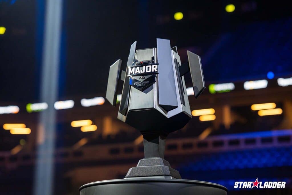 Image of StarLadder Budapest Major 2025 trophy plaecd on top of black barrel.