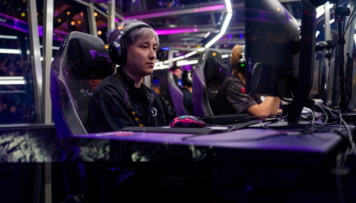 A professional Dota 2 player, Wang 'Ame' Chunyu of Xtreme Gaming, is captured in a close-up, low-angle shot during a tournament match