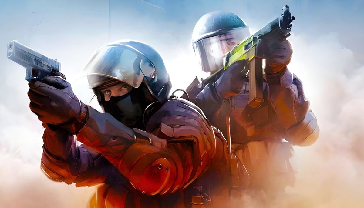 Two counter-terrorist operatives from the video game Counter-Strike in a tactical stance, wearing helmets and gear, and pointing weapons in a dusty, sunlit environment