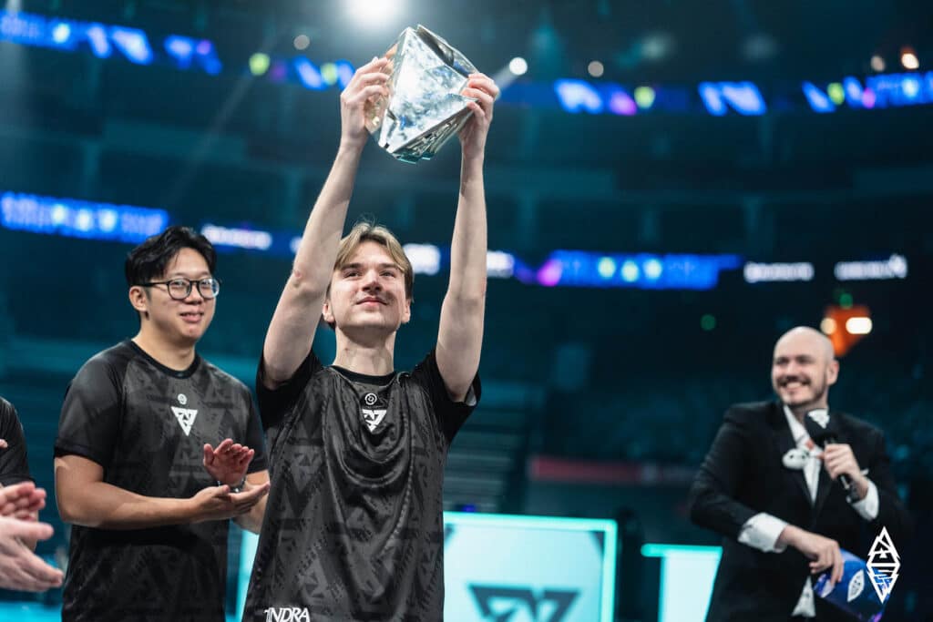 Image of Tundra Esports Dota 2 player lifting trophy at BLAST Slam V
