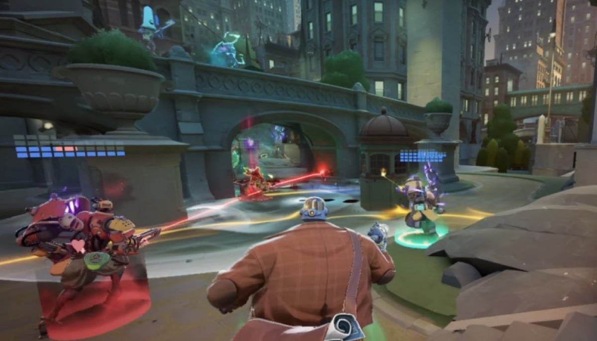The image is an in-game screenshot from the Valve game Deadlock, showcasing third-person shooter and MOBA gameplay in a detailed urban environment. A character wearing a brown coat and fedora is in the foreground, facing an ongoing battle near an archway