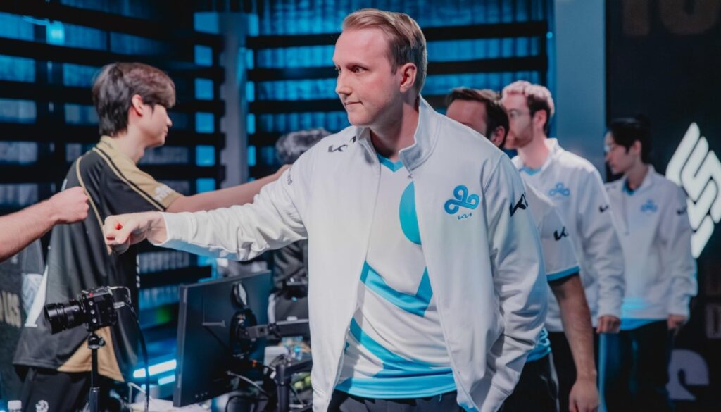 Cloud9 players line up on stage after a match during LCS 2026 Lock-In Week 2, exchanging fist bumps in the Riot Games Arena studio.