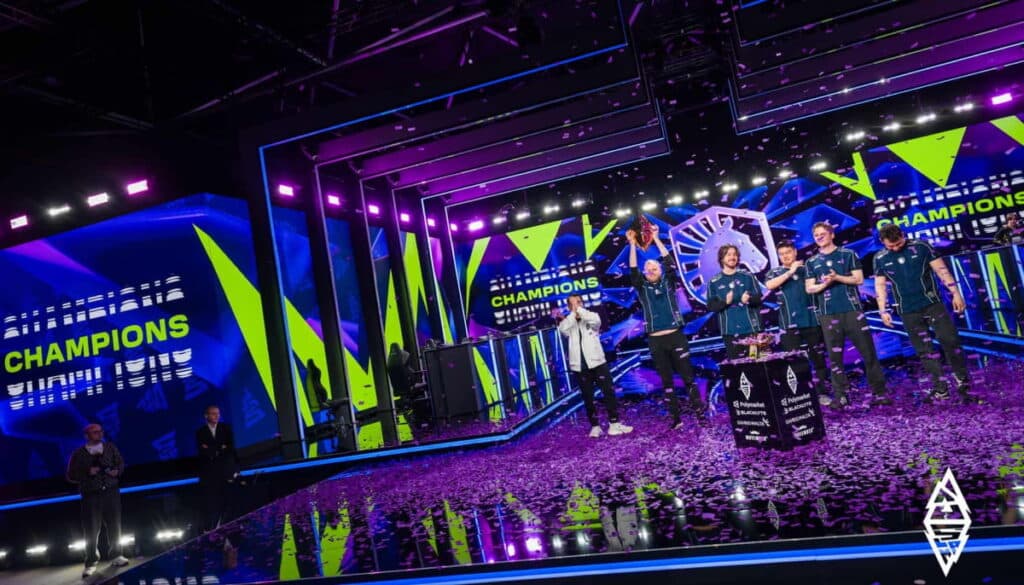 Team Liquid celebrating their BLAST Slam VI victory on stage after winning the Dota 2 grand final