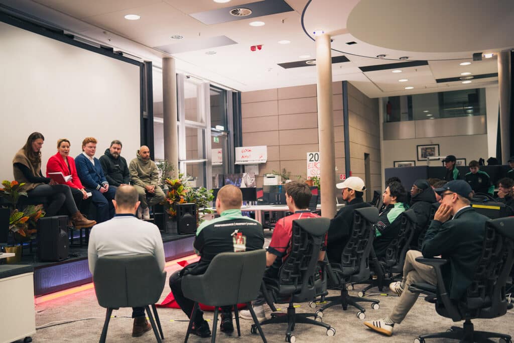Image of G2 Esports representatives and Berlin Senate talking while inside G2 Esports headquarters