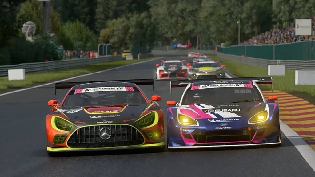 Image ot two Gran Turismo 7 cars racing at Spa-Francochamps. Other cars are in the background