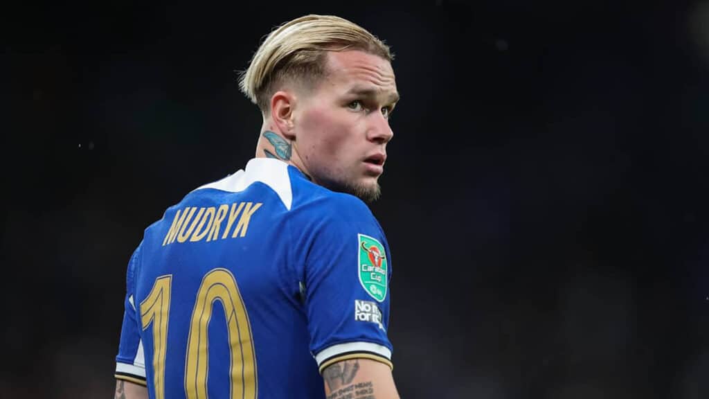Image of Chelsea FC player Mykhailo Mudryk wearing blue Chelsea FC jersey on a black background