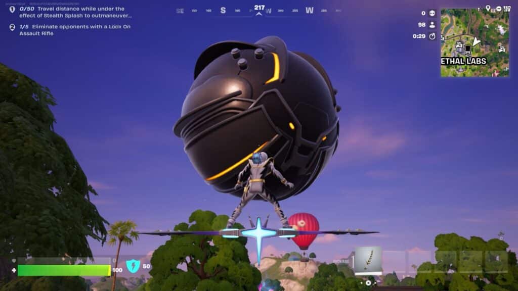 Player gliding toward a giant black orb on the Fortnite map