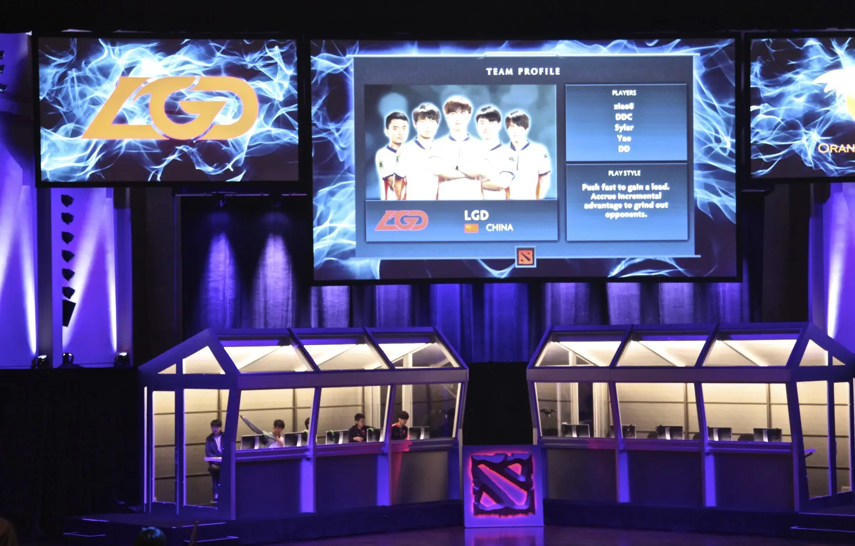 A large screen displaying the LGD Gaming team profile and logo at an esports event.