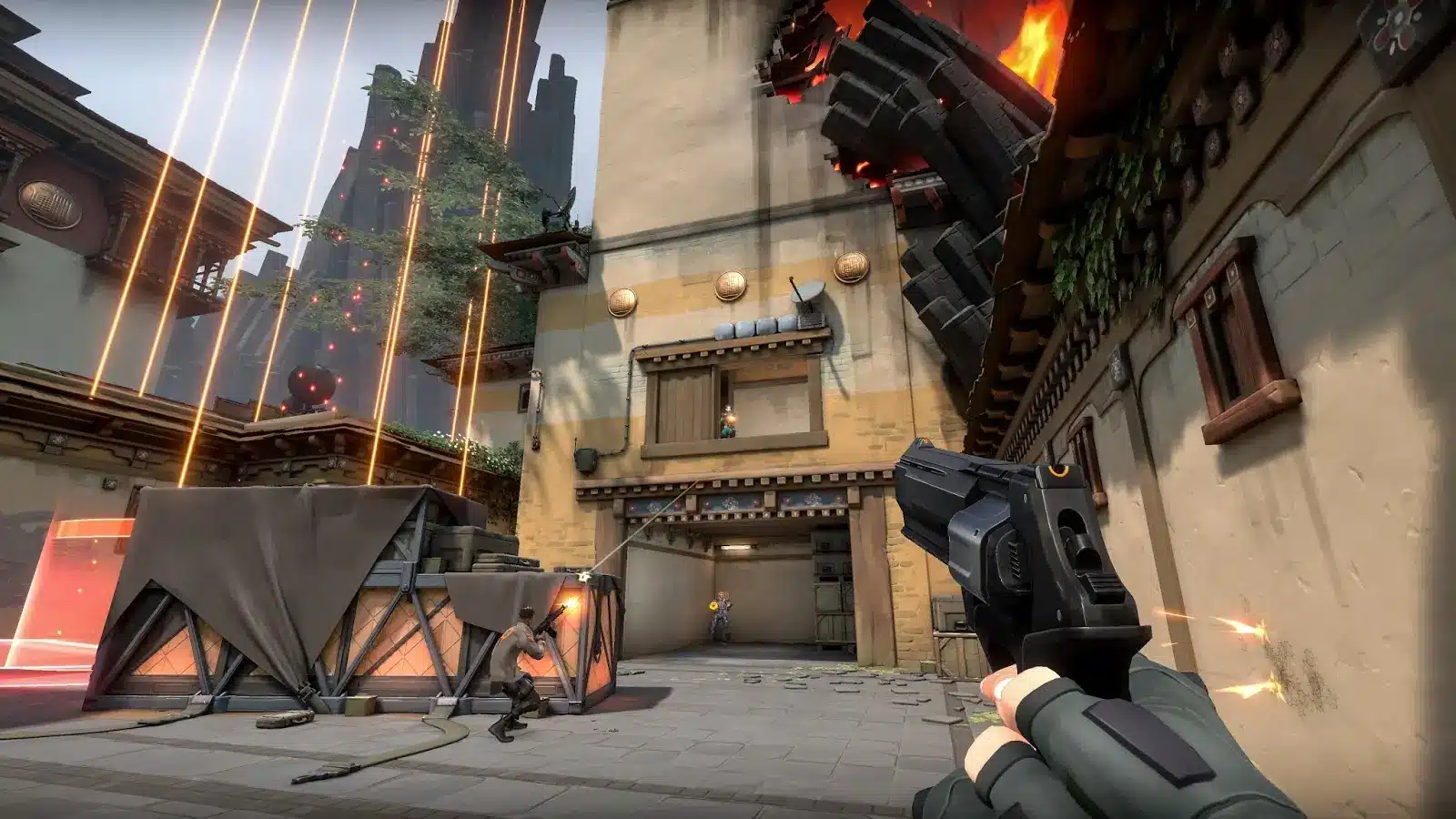 First-person perspective of a player holding a pistol during a match in Valorant.